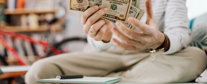 Woman holding money to pay for therapy