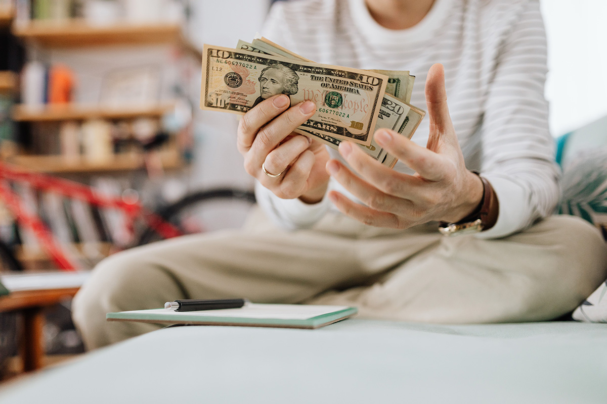 Woman holding money to pay for therapy